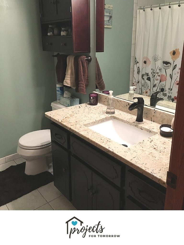 Updated bathroom vanity with granite countertops and gel stained wood