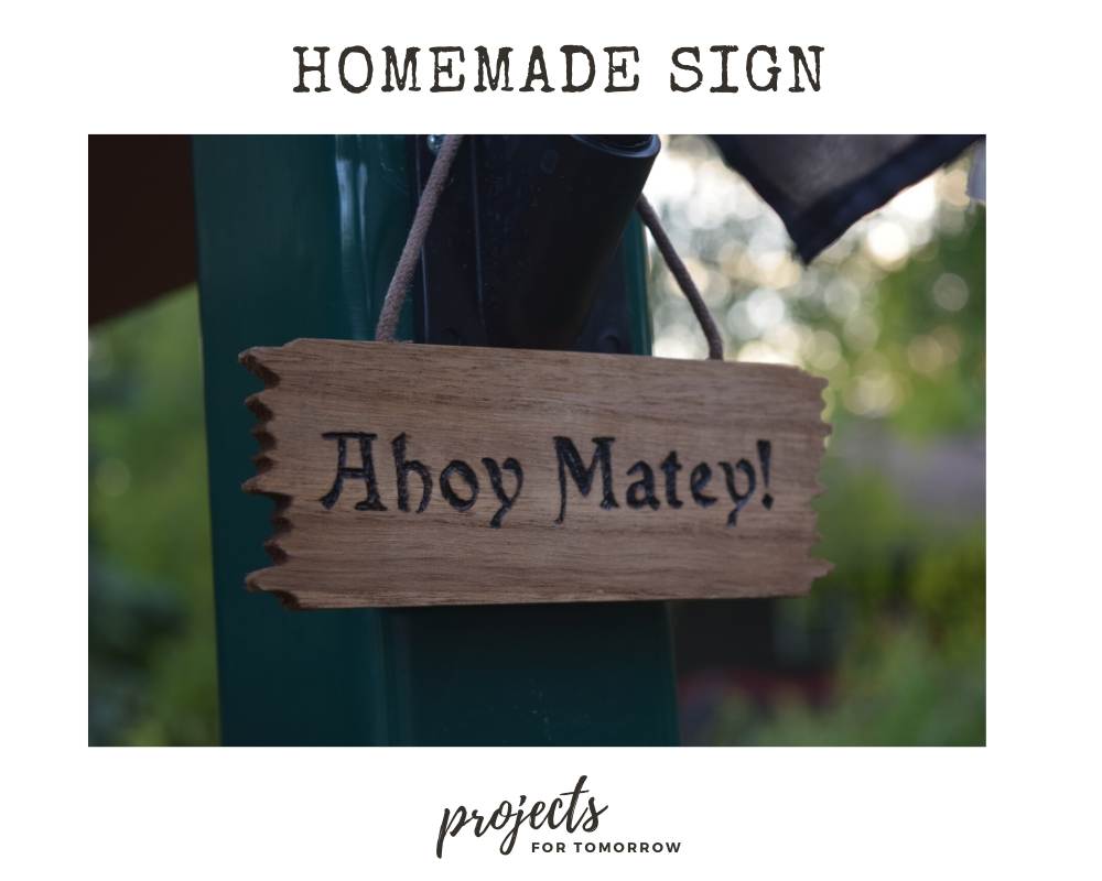 homemade wooden sign that says Ahoy Matey!
