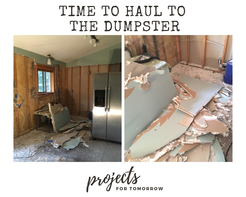 Time to haul that loose drywall to the dumpster after a successful kitchen demolition.