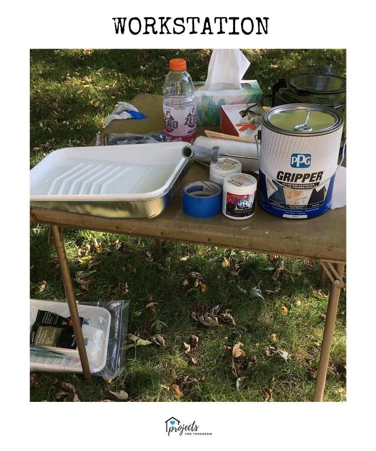 old card table with painting supplies